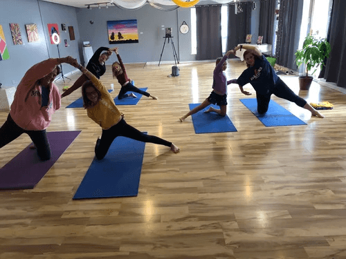 Yoga students in Vinyasa flow at B3 Yoga and Wellness Center, Crest Hill, IL